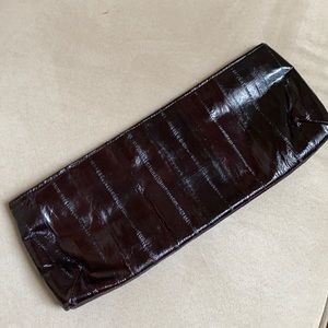 Gorgeous eel skin Lorelei eel skin clutch . Ever so popular right now!